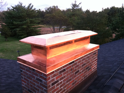 Before and after chimney cap replacement in Freeport, NY