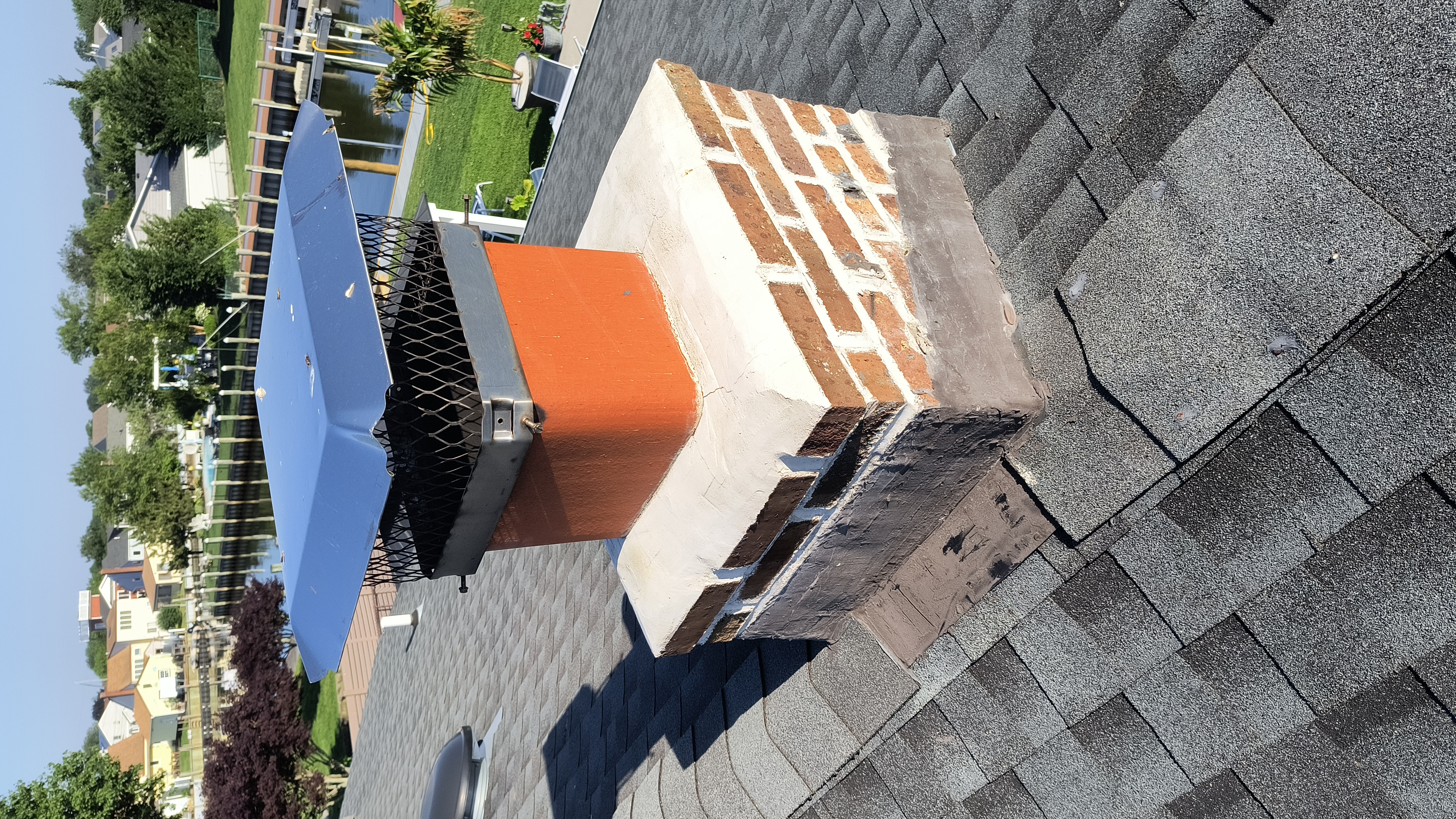 Full chimney masonry rebuild and restoration in Freeport, NY